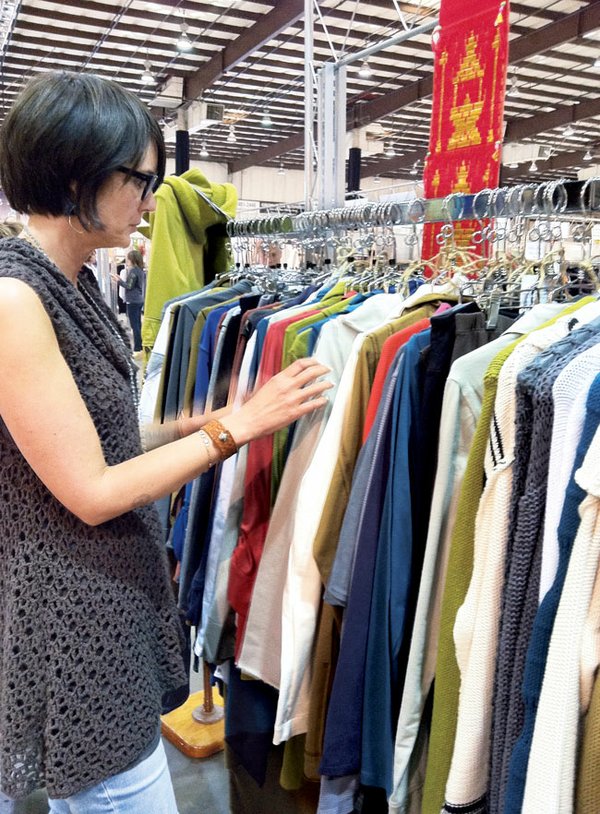 Retailer Erin Mewes, owner of Ethical Clothing in Petaluma, Calif., browsing through a clothing line at FMNC
