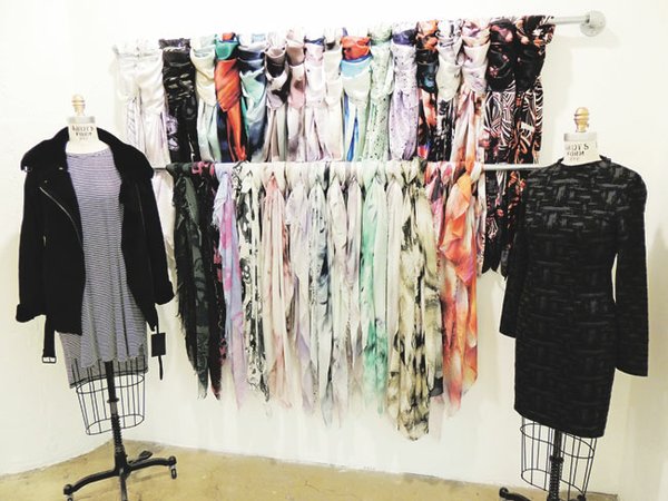A display of Shai Shanti scarves with pieces from the Just Female collection.