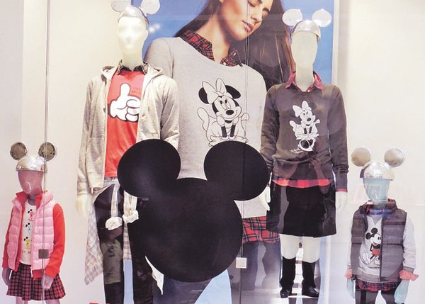 The Uniqlo store at South Coast Plaza features a special store window for the retailer's collaboration with Disney. 