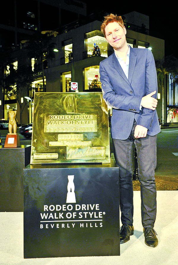 Christopher Bailey with Walk of Style plaque. Photo by Donato Sardella /Getty Images for Burberry.