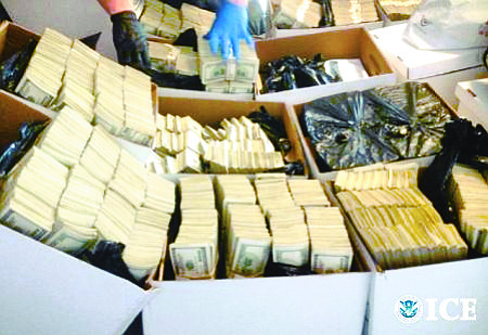 CASH CACHE: Federal investigators raided several fashion businesses and residences allegedly involved in laundering drug money for Mexican cartels. In one condo, they found $35 million in cash stored in cardboard boxes.
