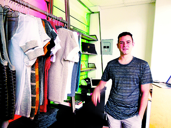 GET SMALL: Alexander Khater at his 60-square-foot boutique