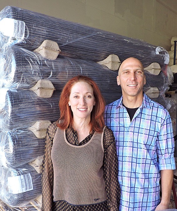 LA HQ: Lauren and Steve Greenberg, pictured in their Los Angeles headquarters, devised a compact
and efficient fabric-packing system that also protects the fabric during shipping. SG Knits uses special spacers between each roll to allow for efficient stacking. The company asks for the recycled spacers to be returned so they can be reused for the next shipment.
