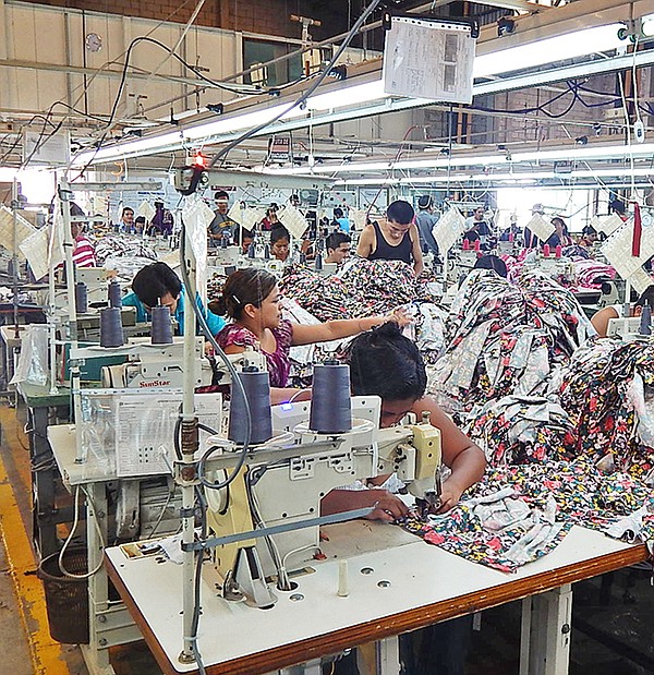 COLOR RULES: Bright tops and dresses are some of the items being sewn at Panamericano Textil II, which used to do primarily maternity wear.