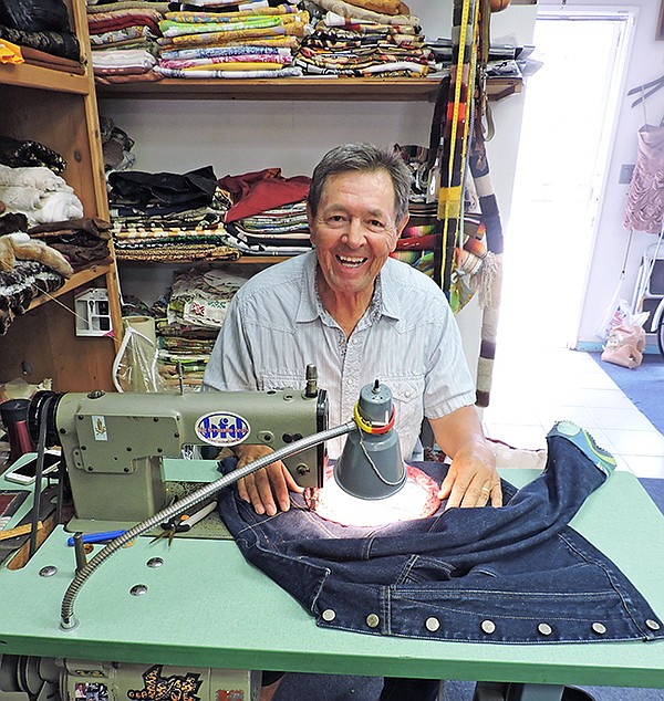 A MAN & HIS SEWING MACHINE: Fernando, the namesake of the Fernando’s boutique in Redondo Beach’s Riviera Village, behind his Juki sewing machine. 