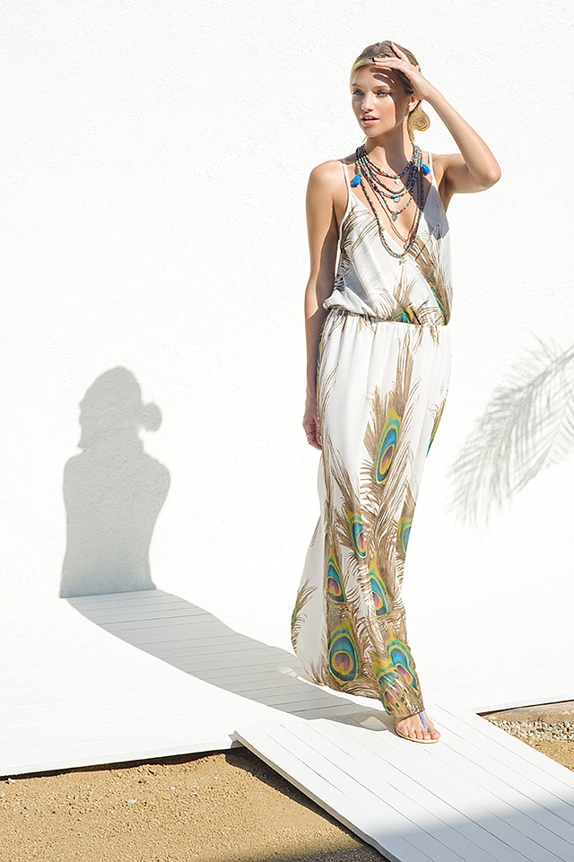SINGLE’s “Peacock” maxi dress. BINDY’s multi-beaded string necklace with turquoise tassels.