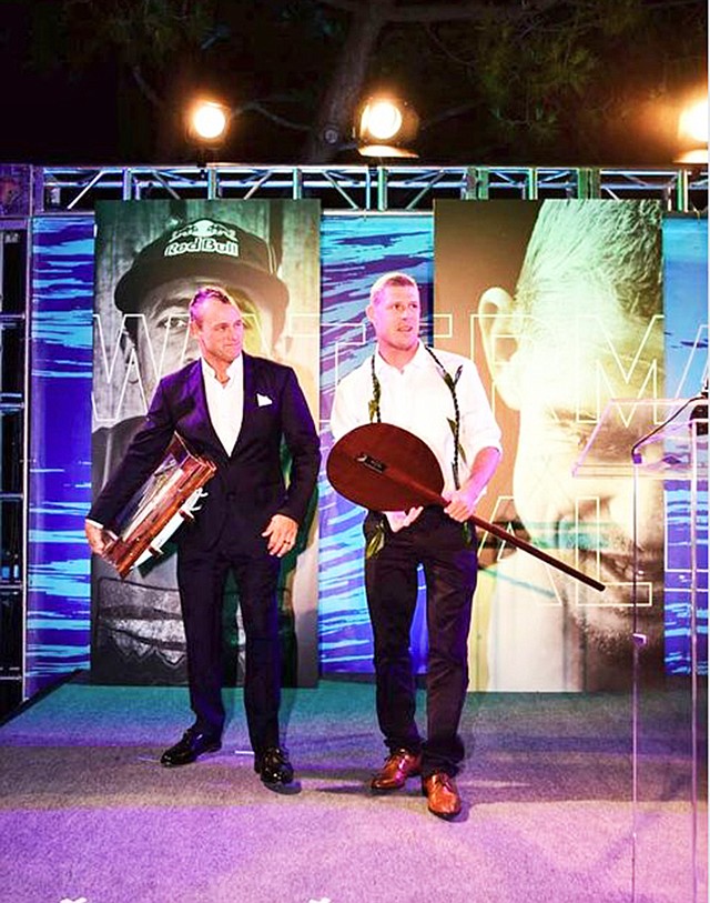 TROPHIES: Mick Fanning, right, receives his Waterman of the Year trophies.