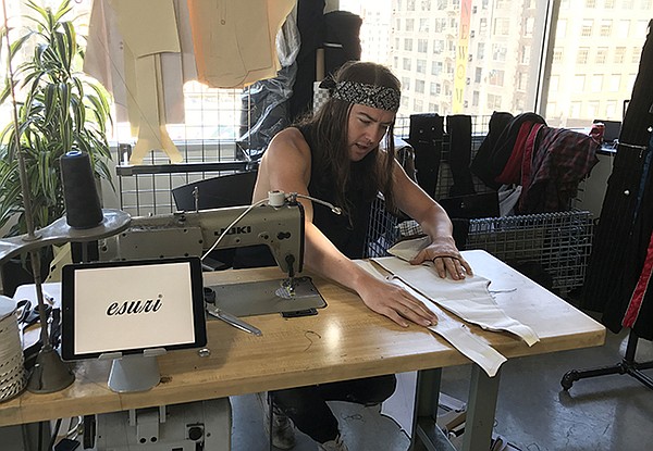 Designer Elliott Evan, making one-of-a-kind garments at Esuri brand booth