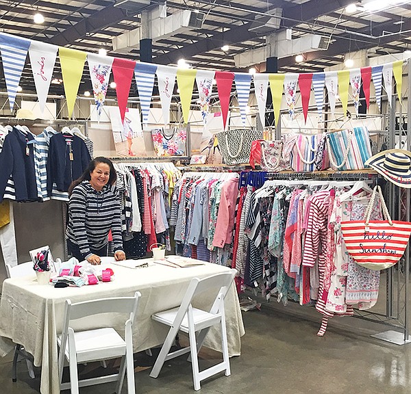 Karen Anderson in her Karen Anderson Showroom booth