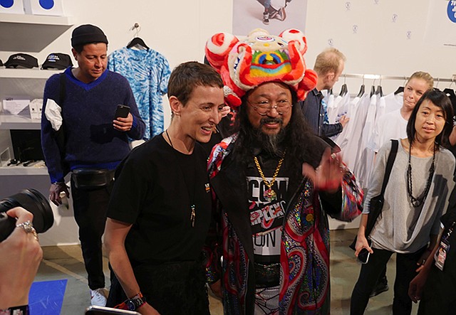Sarah Andelman poses with Takashi Murakami at the Colette Paris booth.