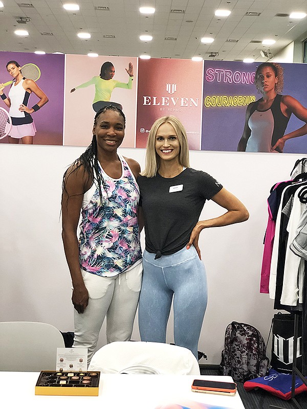 From left, Venus Williams and Devon Damelio, sales manager for Active Collective, at the booth for EleVen by Venus Williams | Photo courtesy of Emerald Expositions