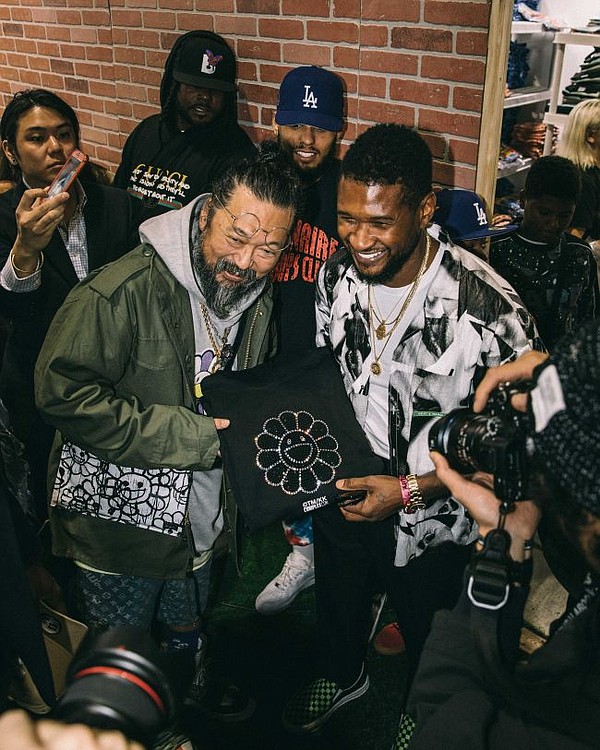 Takashi Murakami and Usher with a Swarovski & Murakami collaboration hoodie. Image courtesy of Swarovski