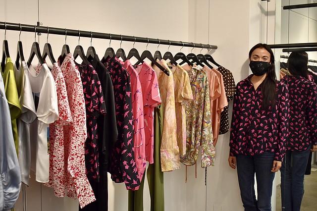 Catherine Gee stands beside her Spring 2021 collection during L.A. Market at the Cooper Design Space. | Photo courtesy of Catherine Gee