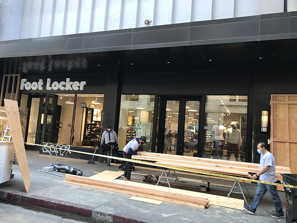 After the killing of George Floyd in May, protests attracted looters to L.A.’s retail streets, forcing retailers to protect their shops by boarding up windows.