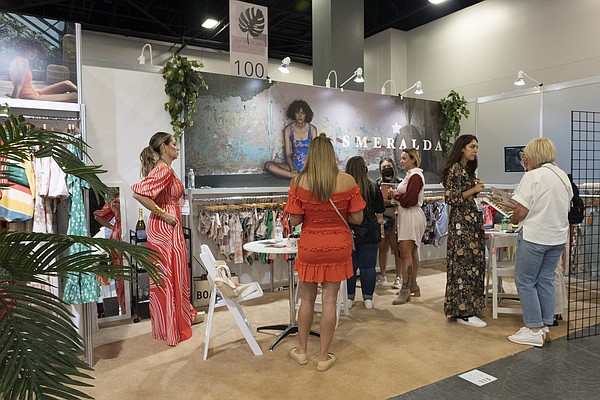 At SwimShow, buyers, such as those pictured at the Smeralda booth, were ready to conduct business on-site following a year of virtual events. | Photo by Tim Regas