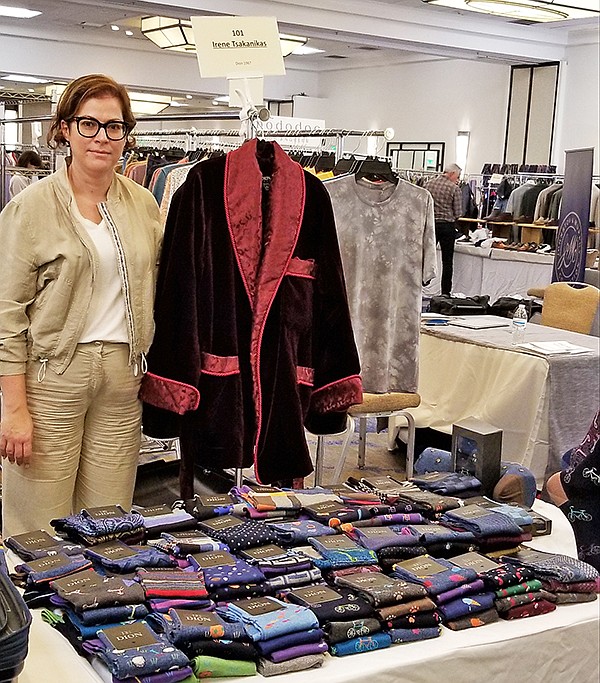 During the CALA Men’s Trend Show, Irene Tsakanikas stands beside show favorite Dion Neckwear Ltd.’s martini jacket, which is one of the Canadian manufacturer’s most-beloved pieces.