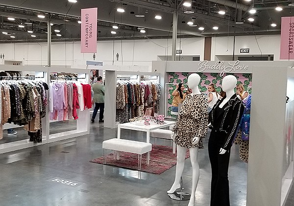 During their visits to MAGIC, buyers were interested in finding unique pieces, but also the tactile experience of examining clothing with exhibitors, such as Buddy Love, which sold out of its hot-pink faux-fur coat.