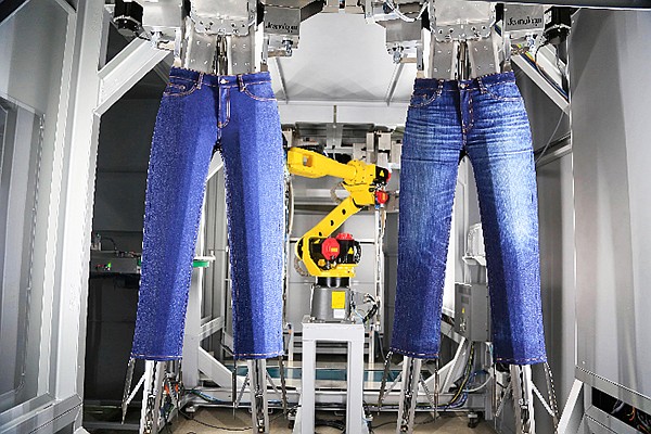 DenimFWD’s Urban Factory is home to the first Handman in the U.S. The Handman by Jeanologia automates the laser-technology process and allows one operator to handle the whole production system. | Image by Jeanologia