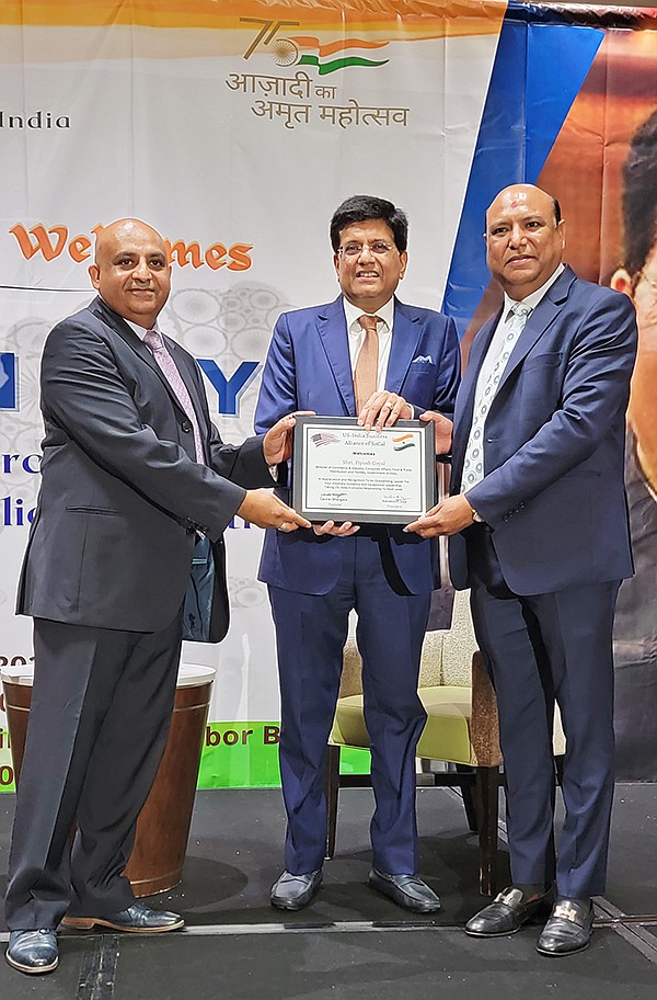 Gaurav Bhargava (left), founder, and Kanaksinh Zala (right), president, of the India Business Alliance of SoCal with India Minister Shri Piyush Goyal (center)