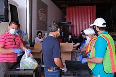 Cotton Heritage Distributes Masks and Groceries To Hundreds