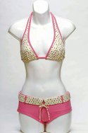 POMPEI BEACHs pink/multicolor polka-dot polyamide/elastane Pralines slide halter with belted brief ($55).