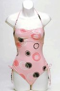 ANNE COLE COLLECTION pink-frost nylon/Lycra spandex And the Bead Goes On one-piece bandeau ($45).