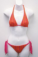 SOFIAs orange-and-pink nylon/spandex polka-dot slider halter and side-tie bikini (call for pricing).