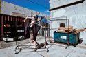 BARDOT sequined bustier dress ($64). ASHLEY B feather fur coat ($400). GLYNNETH B studded choker ($225) and cuff ($155). ALEJANDRA G black spiked Setorii pumps ($190).