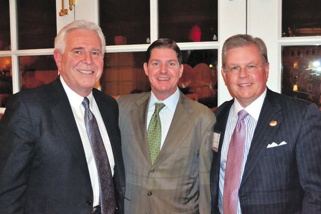 EXECUTIVE CHANGE: New AAFA Chairman Philip Williamson, chairman, president and CEO of Williamson-Dickie Co., flanked by Rick Darling, president of LF USA, left, and AAFA President and Chief Executive Officer Kevin Burke, right.