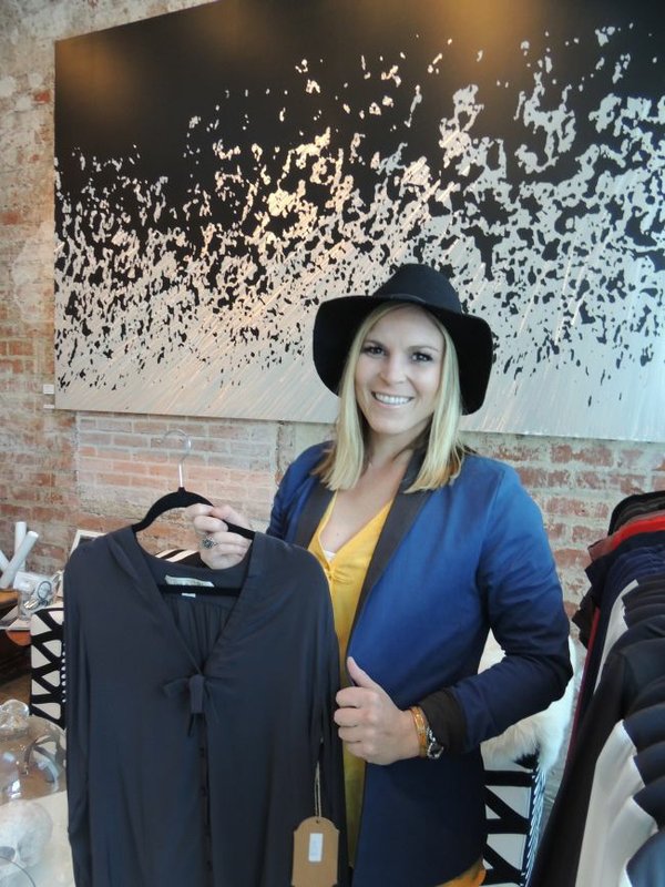 Carrie Licciardi holds a top from the Prêt à Porter line at the Jewelmint pop-up shop. 
