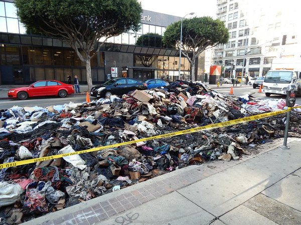 PILED UP: Inventory from Lyn Décor occupied two lanes of Ninth Street after the fire.