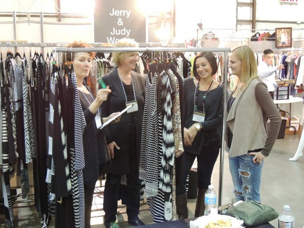 TO SHOP: Judy Wexler of Mystree, left, at Fashion Market Northern California with buyers from Napa Valley Casual boutique. (Photos by Andrew Asch)