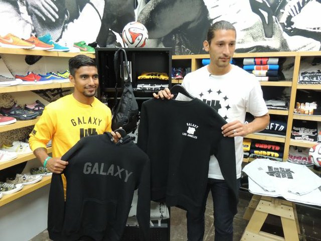 Galaxy Defenders A.J. DeLaGarza, left, and Omar Gonzalez show off looks from the LA Galaxy X UNDFTD capsule collection at the Undefeated shop in Santa Monica.