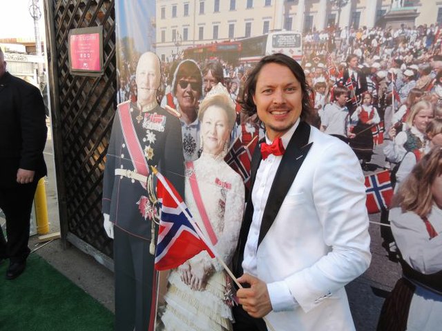 Stefan Dahlkvist with cardboard cut outs of Norway's King Harald and Queen Sonja on May 17 party at the Moods of Norway store.