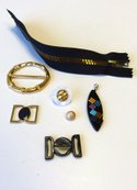 Gold Standard: JN Zippers #5 Plastic mirror Antique Brass NN240; Seram Europe #N020627XT/0000 “Pendentif Ova”; Emsig #A3819 closure; Emsig #SQ210811 buckle; Emsig button #BW084731 button; Emsig #SQ213701 clasp; Emsig #ELY219 button
