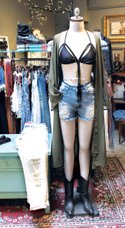 Anemone “All Tied Up” bikini top ($28), Signatures denim shorts ($44), Audrey long green cardigan ($52)