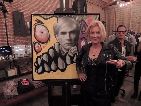 Karen + Bystedt in front of a Lost Warhol lithograph at Guerilla Atelier on Dec. 10.