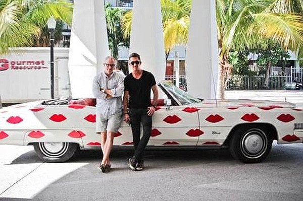 Donald Drawbertson and Davis Factor in front of the 1974 Cadillac El Dorado/gallery of Drawbertson's work that will be driving to the Cooper Design Space noon, Mon. Jan., 12.  Image courtesy of Cooper Design Space.