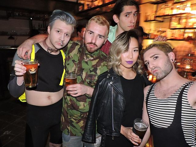 Seen at Underbelly's debut: Sean East, at left with blue hair, Sinh Vo, second to right and Gregory Darling at right, with an unnamed friend and a photobomber.