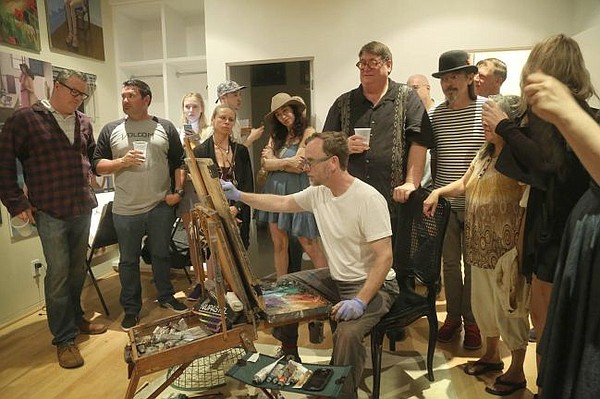 Alex Schaefer live painting in a private home in Venice. Photo by Eric Minh Swenson.