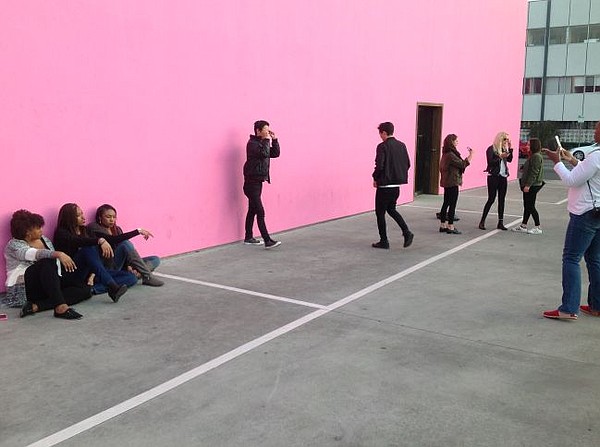 Street scene at Paul Smith parking lot on Jan. 2. People take photos with backdrop of shop's unique pink walls.