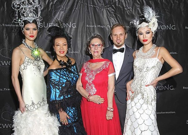 Sue Wong in blue gown, with models and an unnamed male guest. In red gown Alexandrina Doheny. Picture by Sheri Determan