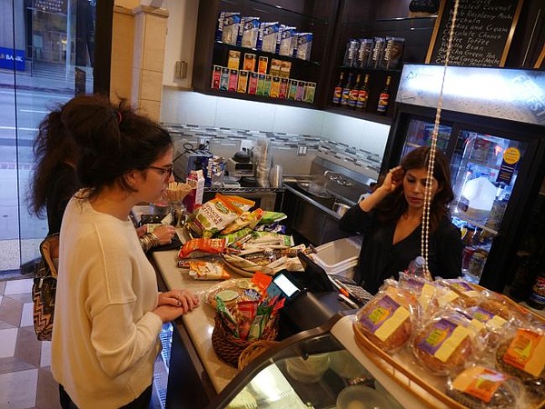 Express Presto  on its first day of business. Ana Martinez-Ayala, the owner, is behind the counter.