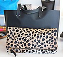 Fold-over cheetah-print leather clutch ($275) and black “Suki” bag ($365)