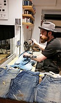 At the Denham the Jeansmaker men’s store, there’s an in-house tailor working in the shop floor and customers can get their jeans washed on-site as well.  