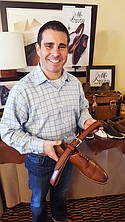 Cory Cozzetti, territory manager for Johnston & Murphy, showing his No. 1 seller, the “Conard Cap Toe” and matching belt