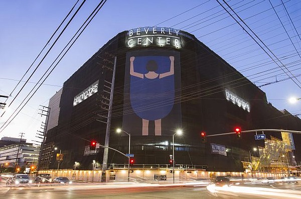 Girl Lifting Skirt 2 by Geoff McFetridge, exhibited at Beverly Center's exterior. Photo by Charlie Cho. Courtesy of Beverly Center.