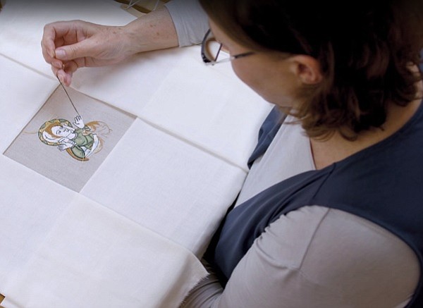 Embroiderer Rosie Taylor-Davies recreates a portion of a 14th-century embroidered design for a film made for the  “Opus Anglicanum: Masterpieces of English Medieval Embroidery” exhibition at London’s Victoria & Albert Museum. 