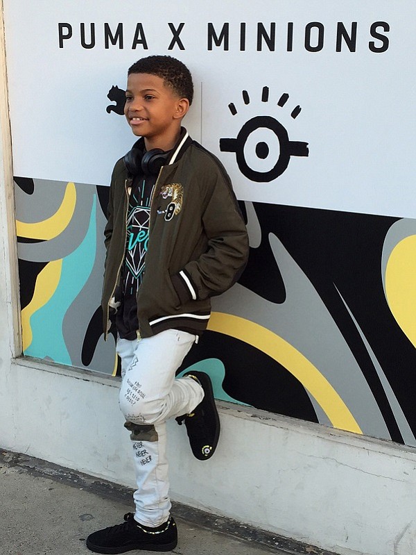 “This Is Us” actor Lonnie Chavis decked out in his Minions skater shoes for the launch party