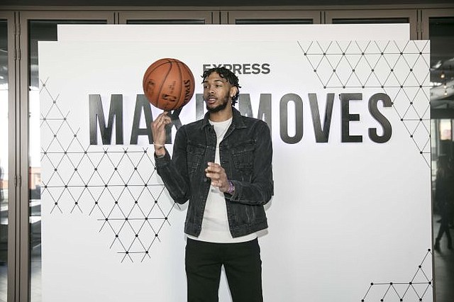 The Lakers'  Brandon Ingram Wearing Express Black Distressed Denim Trucker Jacket and Express Jeans. Image courtesy of Express.